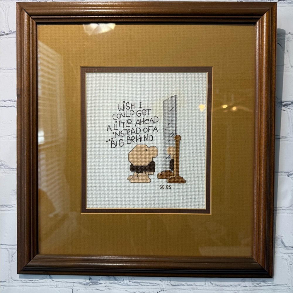 1985 framed cross stitched Ziggy design